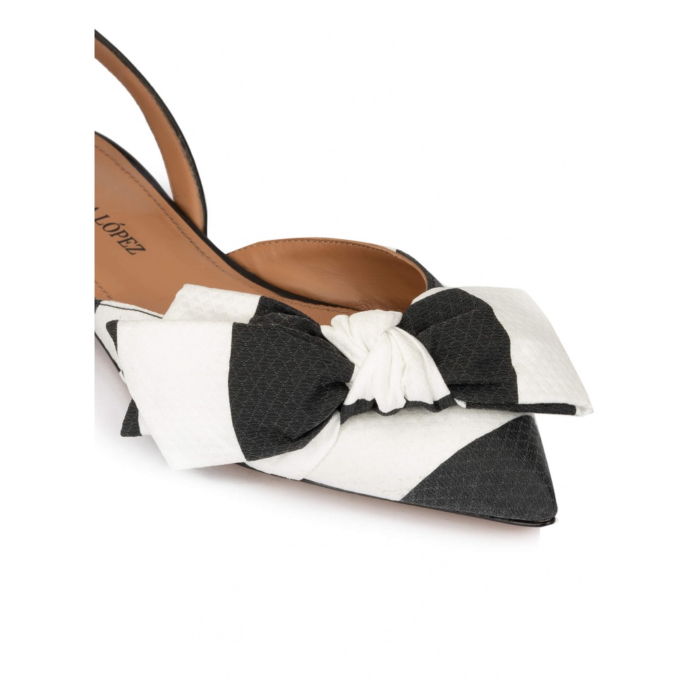 Bow detailed point-toe flats in black and white fabric