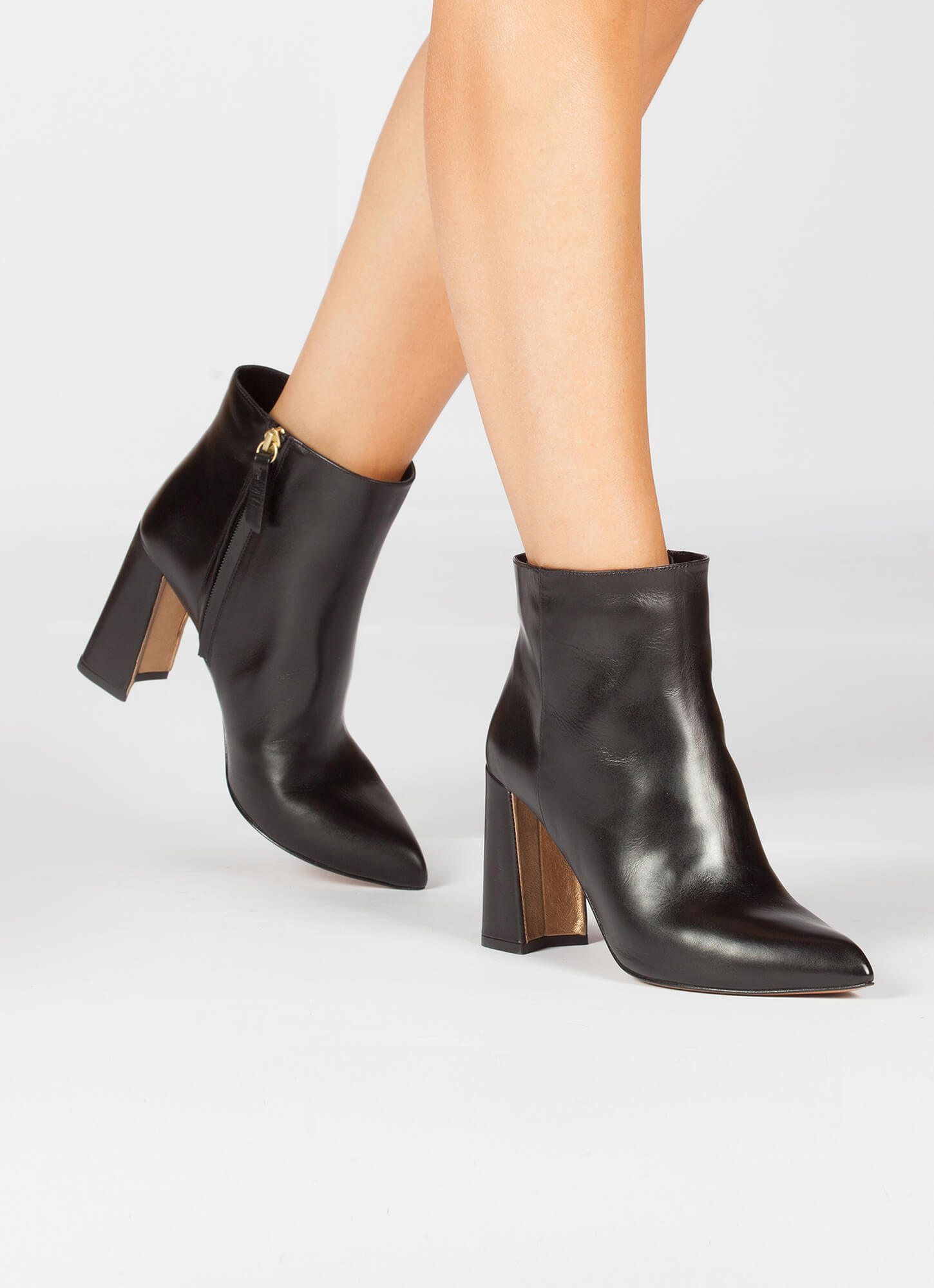 Black leather high block heel ankle boots . PURA LOPEZ