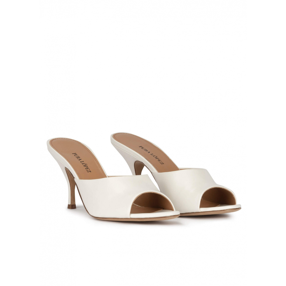 Mid curved heel mules in off-white leather