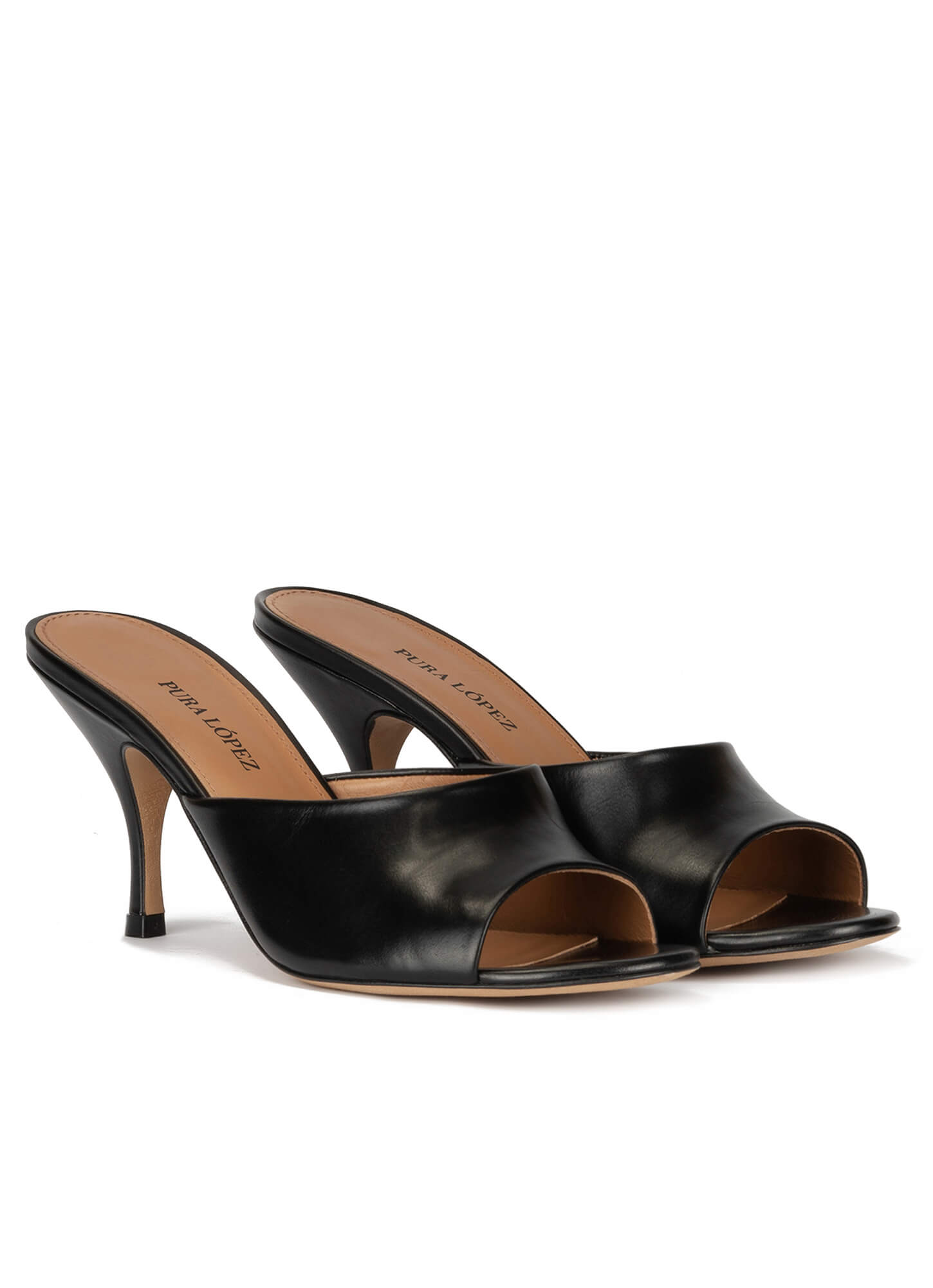 Mid heel mules in black leather . PURA LOPEZ