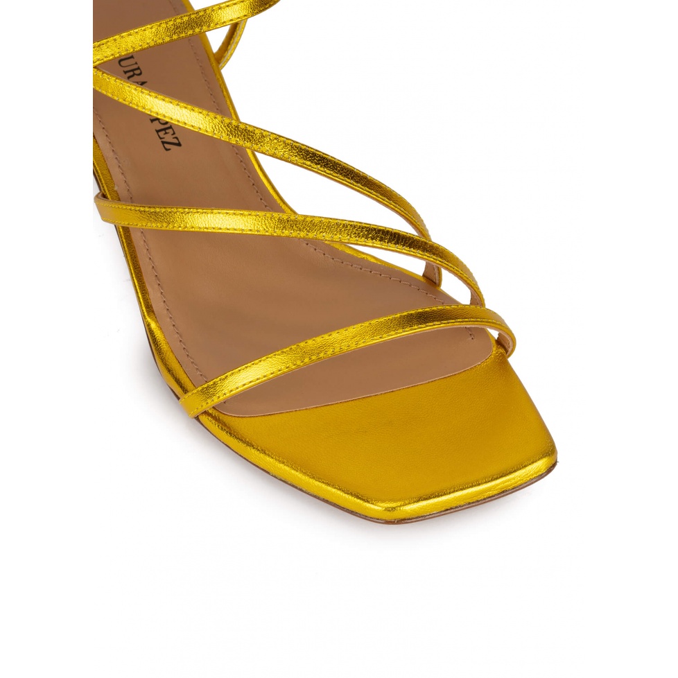 Yellow strappy mid heel sandals in metallic leather