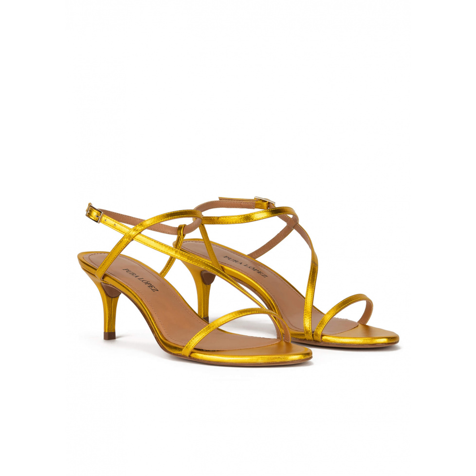 Strappy mid-heeled sandals in yellow metallic leather