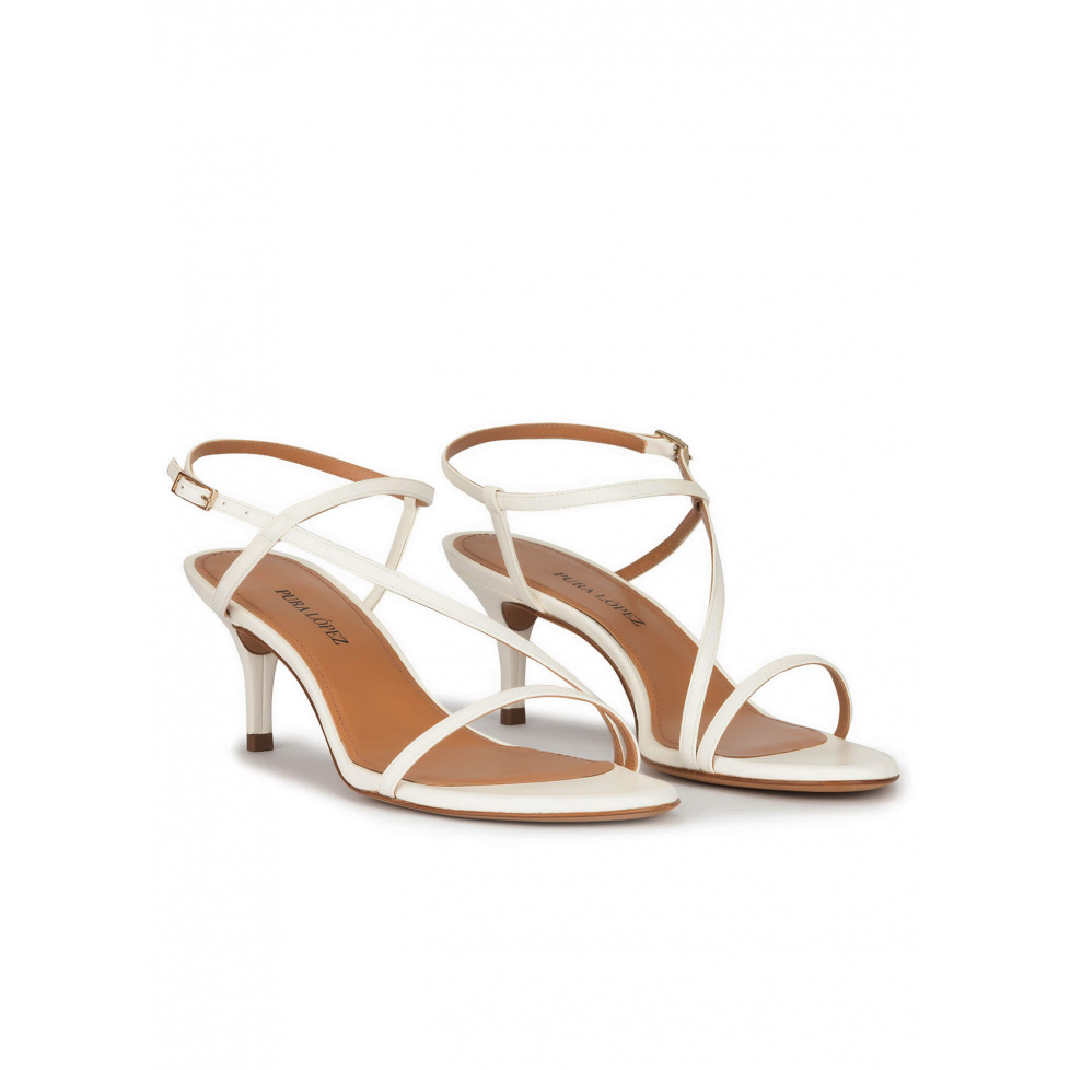 Strappy mid heeled sandals in off-white leather