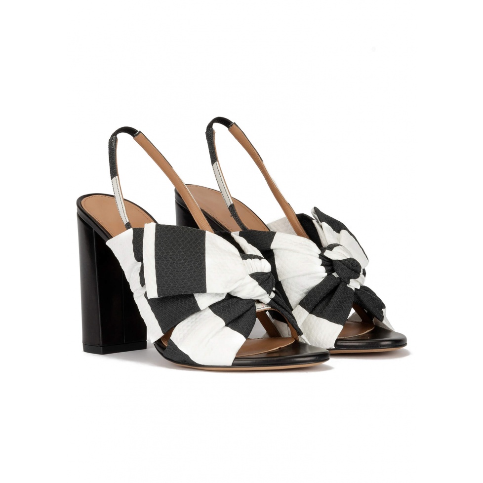 Bow detailed high block heel sandals in black and white