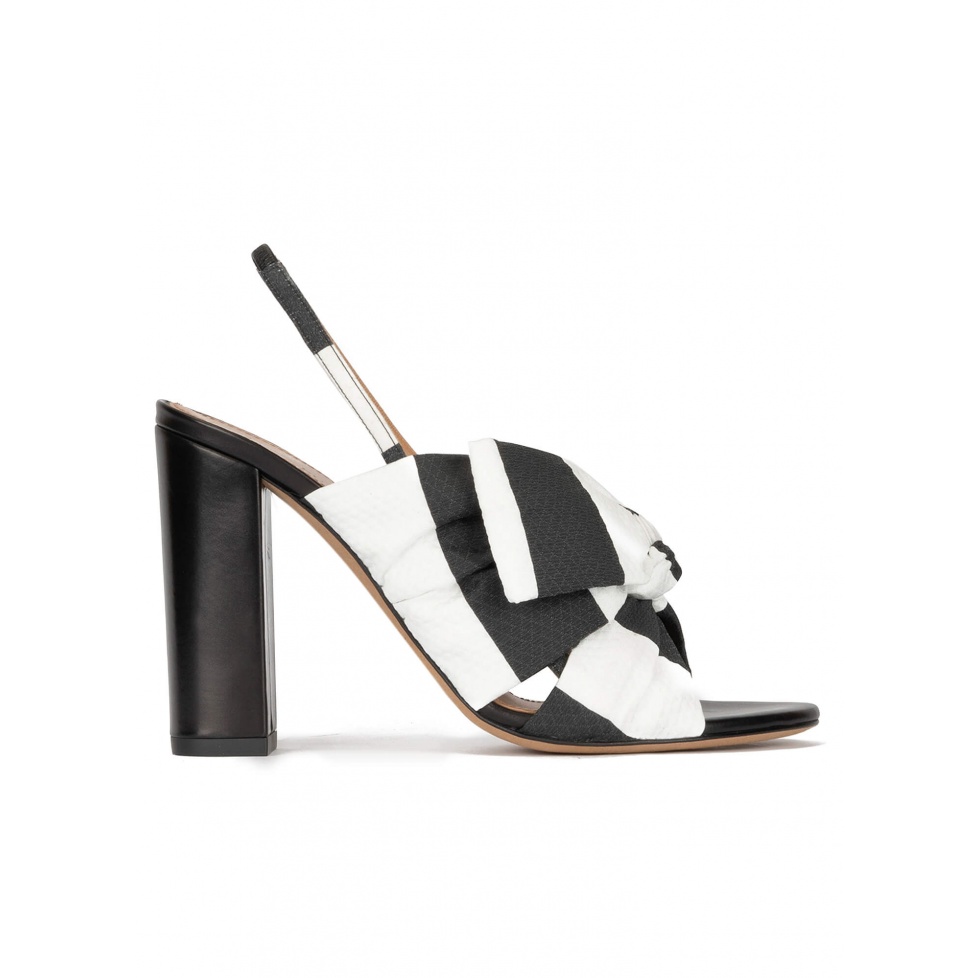 Bow detailed high block heel sandals in black and white