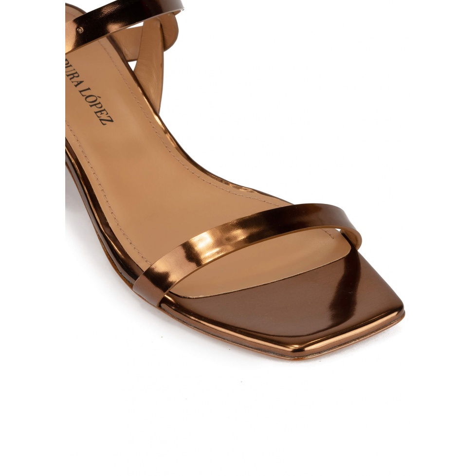 Bronze mid block heel sandals in metallic leather