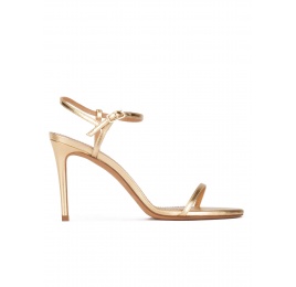 Strappy high heel sandals in gold leather Pura López