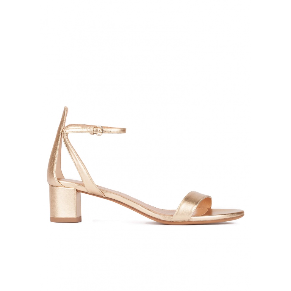 Strappy mid block heel sandals in gold metallic leather