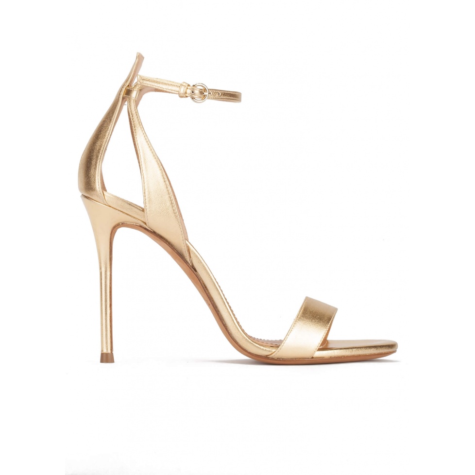 Ankle-strap high heeled sandals in gold metallic leather