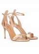 Ankle strap high-heeled sandals in gold leather