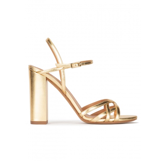 Gold high block heel sandals in metallic leather Pura López