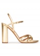 Gold high block heel sandals in metallic leather