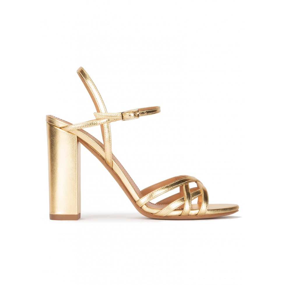 Gold high block heel sandals in metallic leather