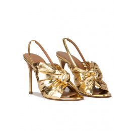 Bow detailed gold high heel sandals in metallic leather Pura López