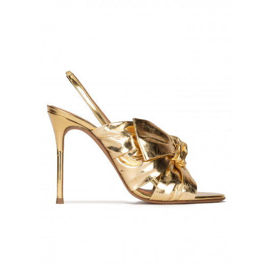 Bow detailed gold high heel sandals in metallic leather Pura López