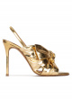 Bow detailed gold high heel sandals in metallic leather