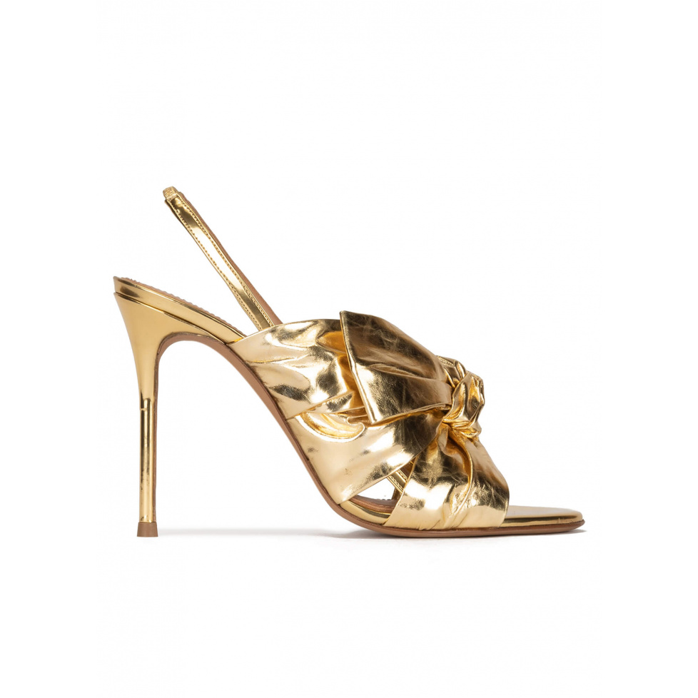 Bow detailed gold high heel sandals in metallic leather