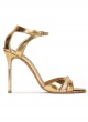 Gold high heel sandals in metallic leather