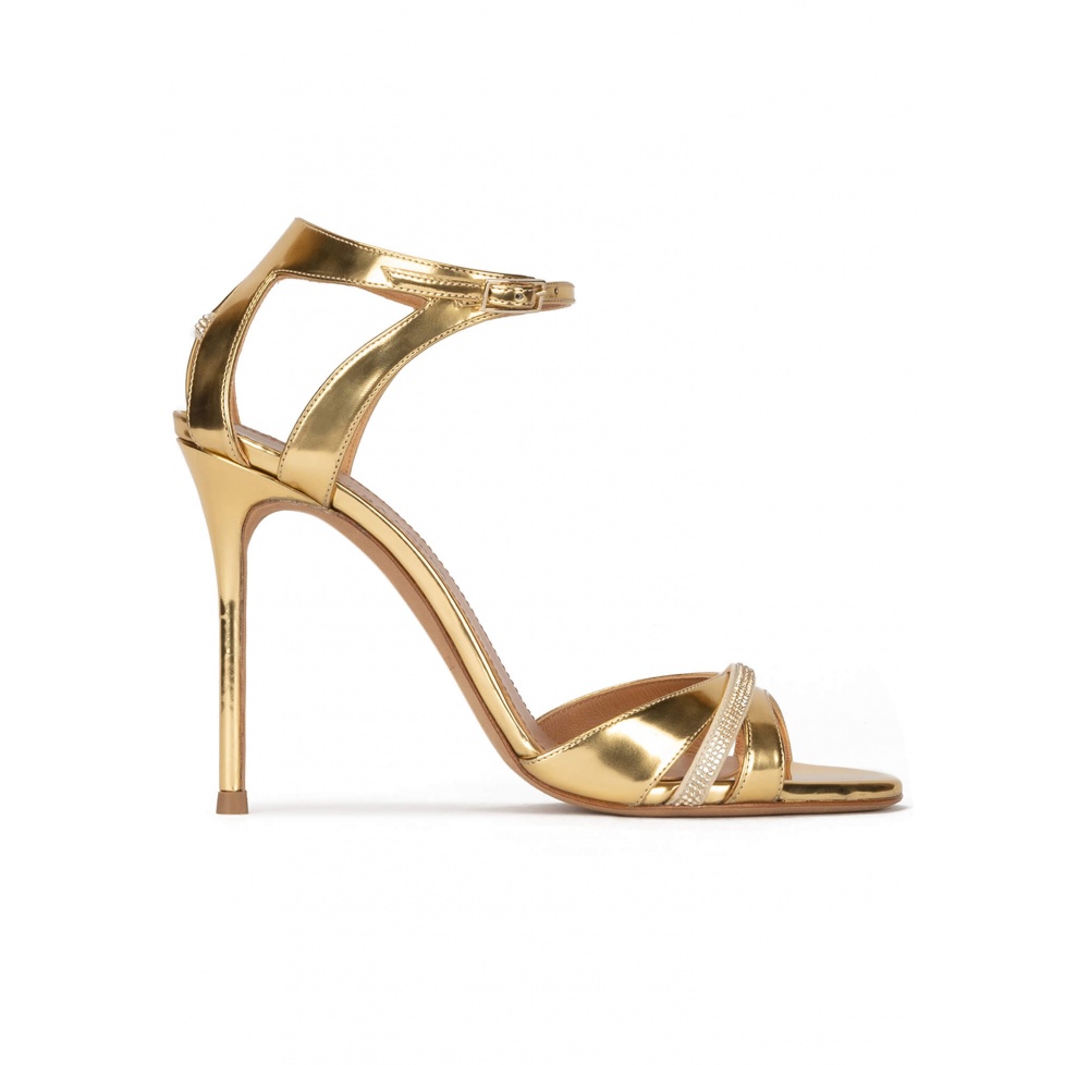 Gold high heel sandals in metallic leather . PURA LOPEZ