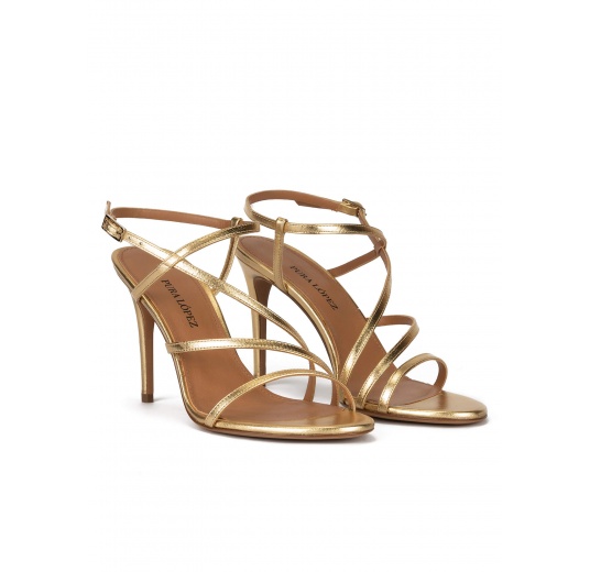 Strappy high heel sandals in gold leather Pura López