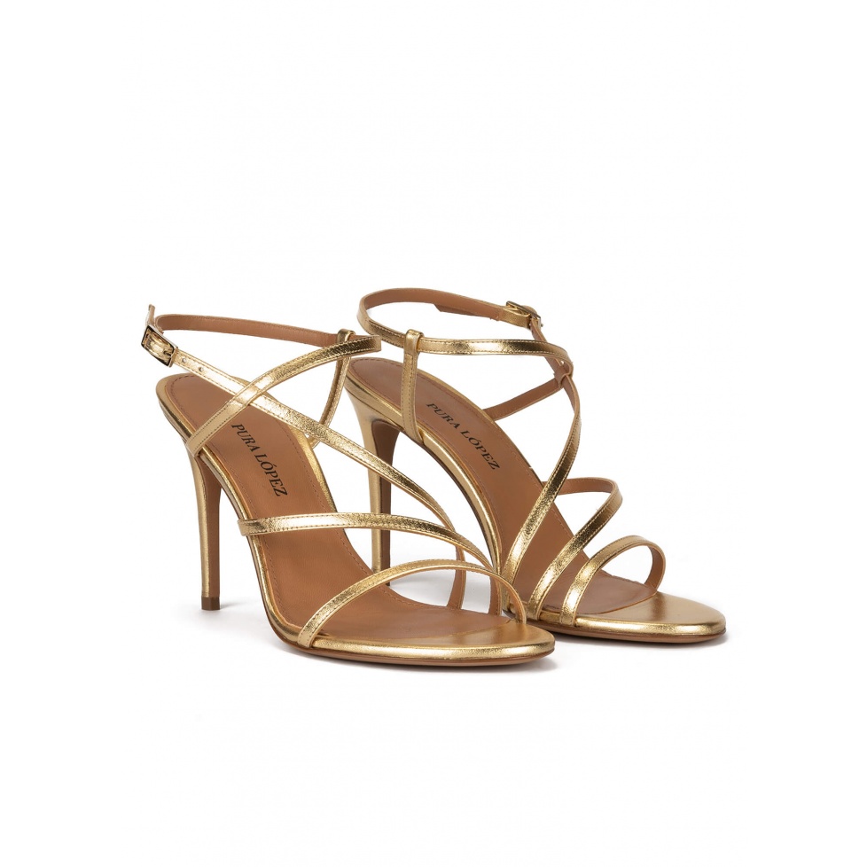 Strappy high heel sandals in gold leather