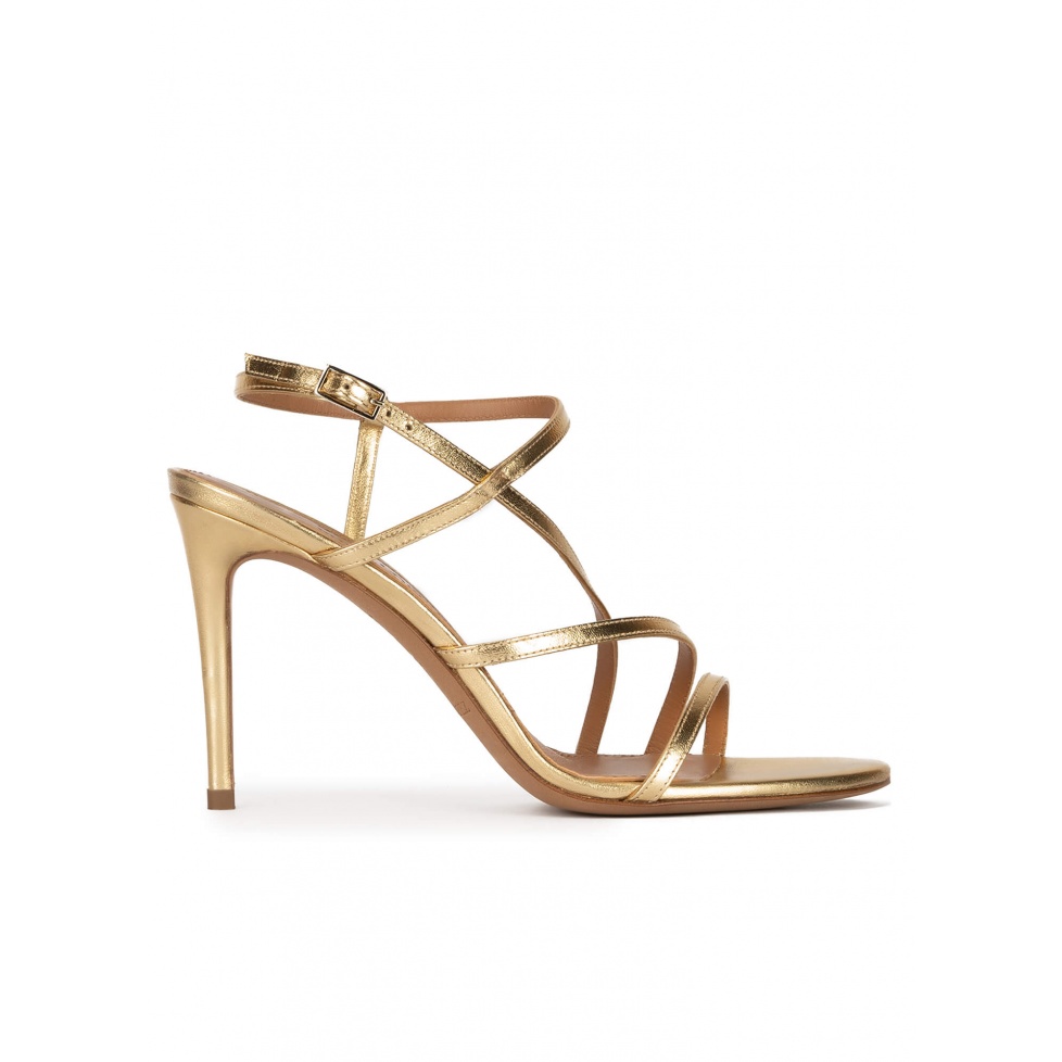 Strappy high heel sandals in gold leather