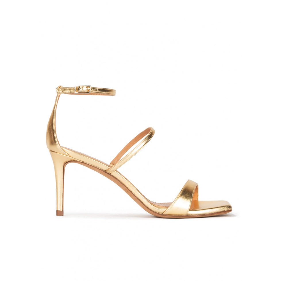 Ankle strap mid heel sandals in gold leather