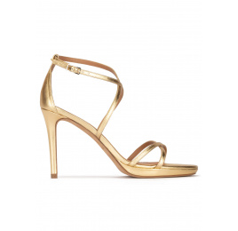 Gold high heel sandals in metallic leather . PURA LOPEZ