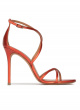 Crossed-strap high heel sandals in coral metallic leather