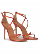 Crossed-strap high heel sandals in coral metallic leather