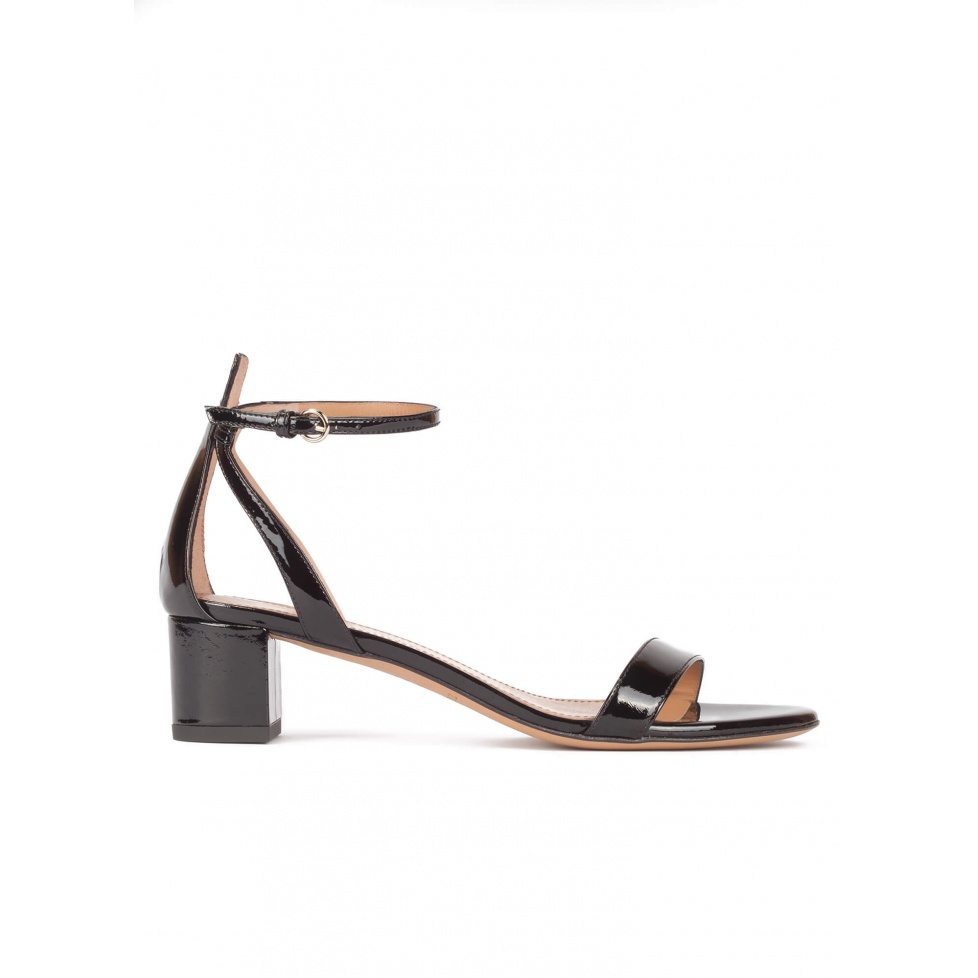 Mid block heel sandals in black patent leather with ankle strap