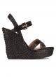 High wedge sandals in black raffia with buckle fastening