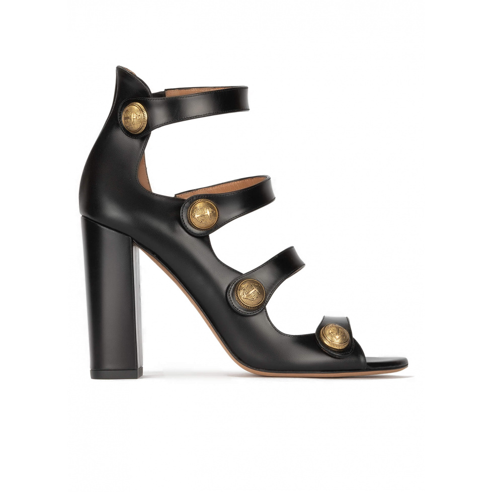 High block heel sandals in black leather with golden buttons