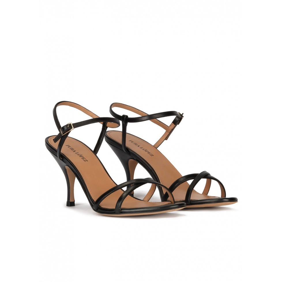 Strappy mid curved heel sandals in black leather