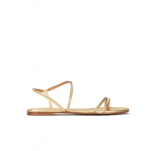 Golden strappy flat sandals in leather with pyramid studs Pura López