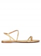 Golden strappy flat sandals in leather with pyramid studs
