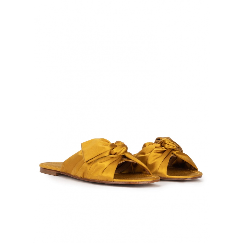 Bow detailed flat sandals in ocher satin