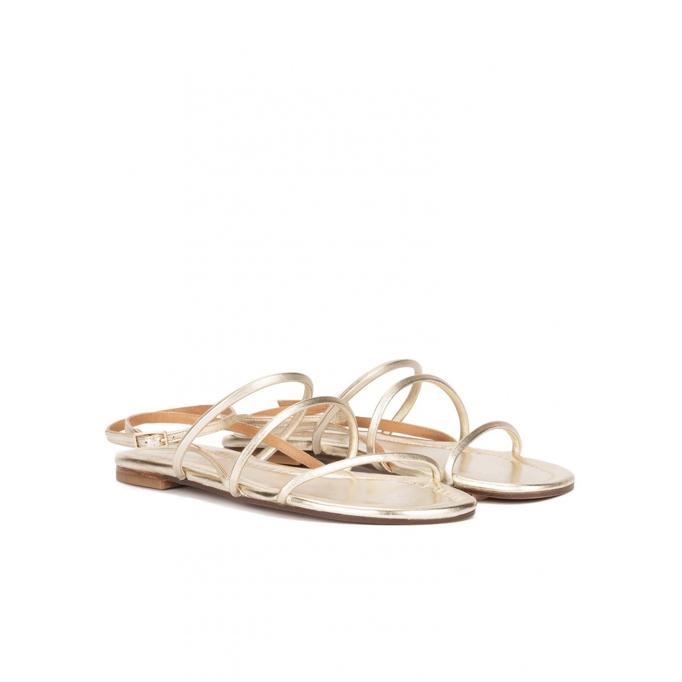 Ankle strap flat sandals in platin metallic leather