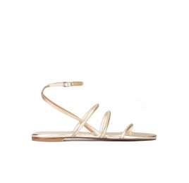 Ankle strap flat sandals in platin metallic leather Pura López