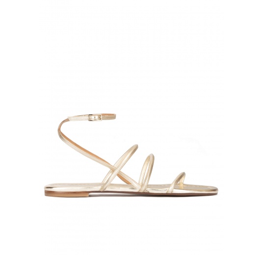 Ankle strap flat sandals in platin metallic leather Pura López