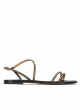 Strappy flat sandals in black leather with golden studs