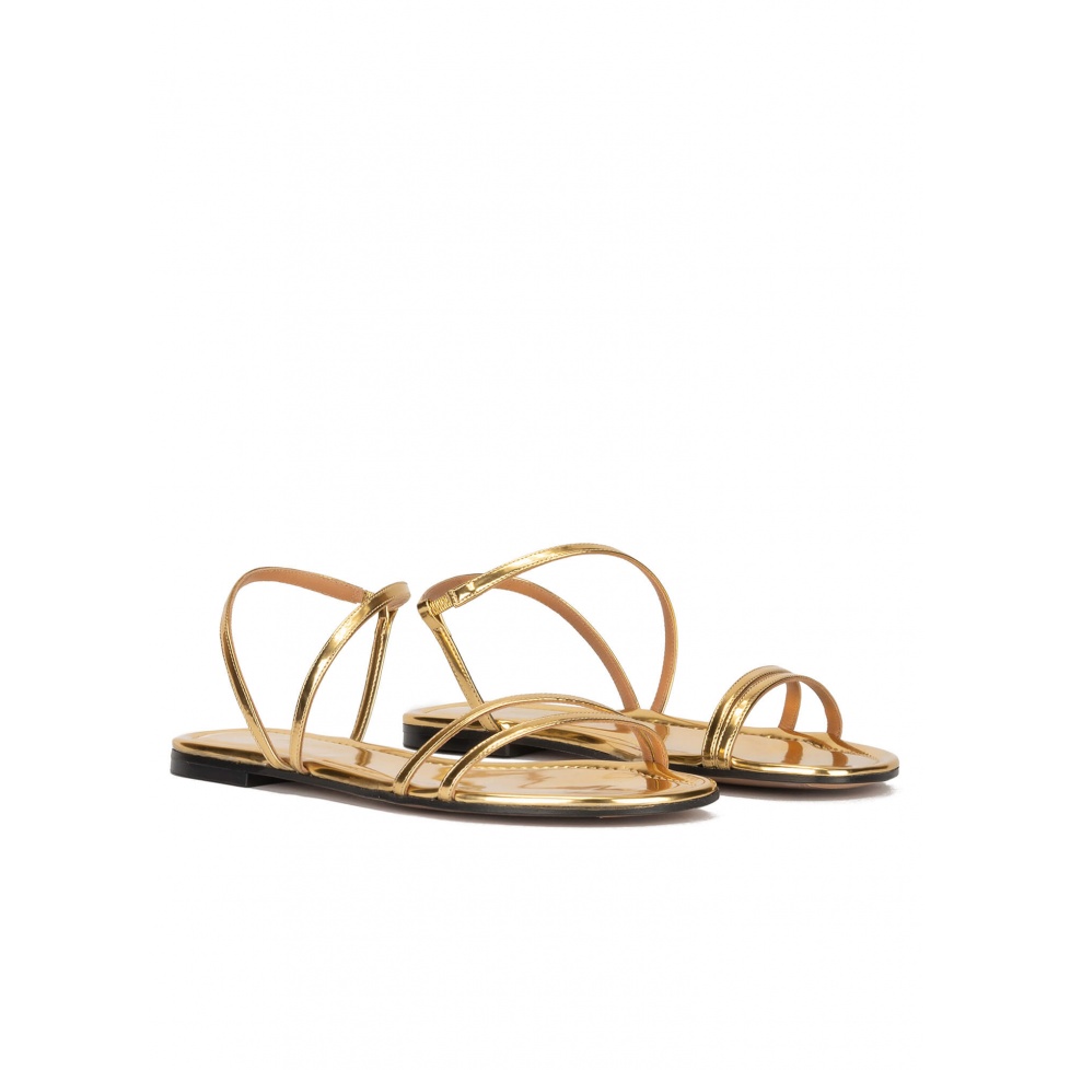 Multi-strap flat sandals in gold mirrored leather