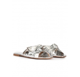 Flat sandals with bow detail made from silver fabric Pura López