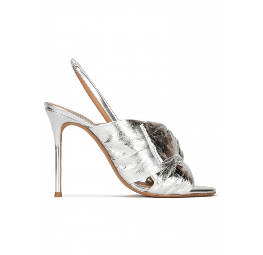 Bow embellished silver high heel sandals in metallic leather Pura López