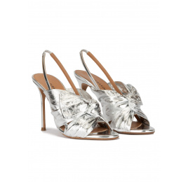 Bow embellished silver high heel sandals in metallic leather Pura López