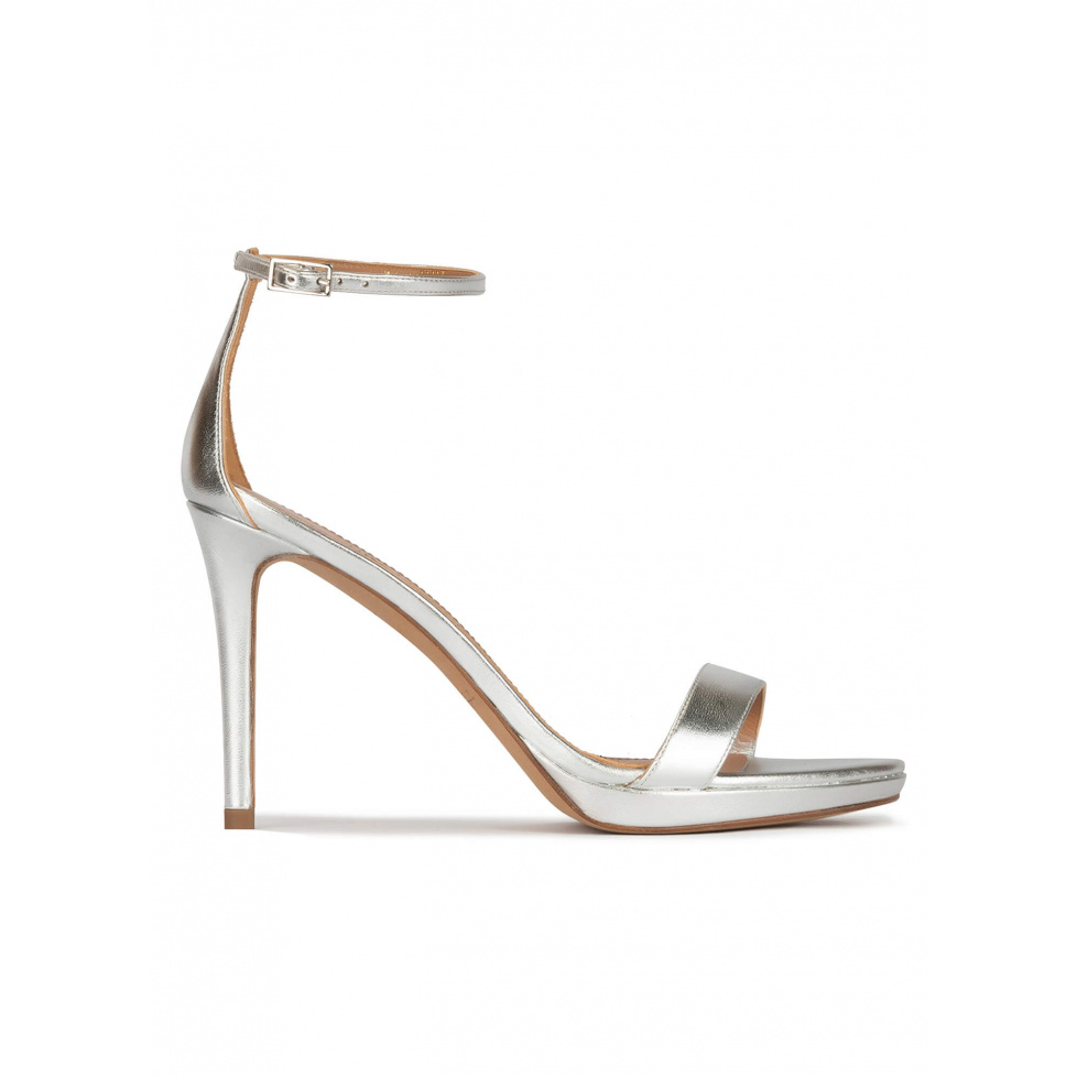 Silver platform heeled sandals in metallic leather