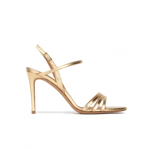 Strappy high-heeled sandals in gold metallic leather Pura López