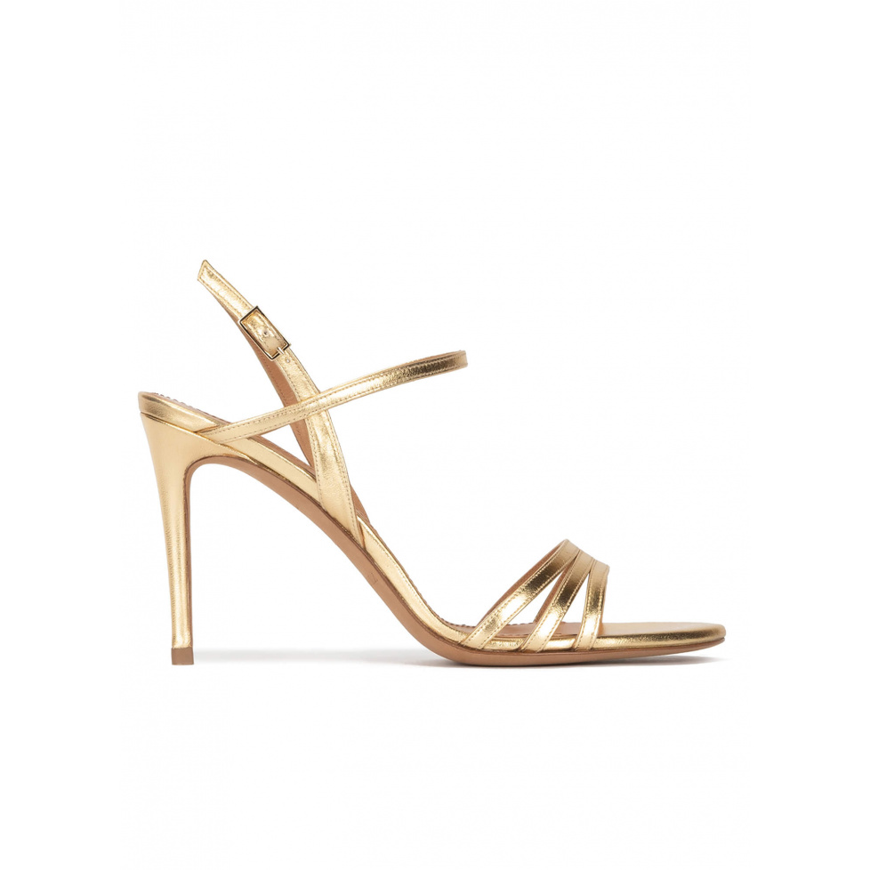 Strappy high-heeled sandals in gold metallic leather