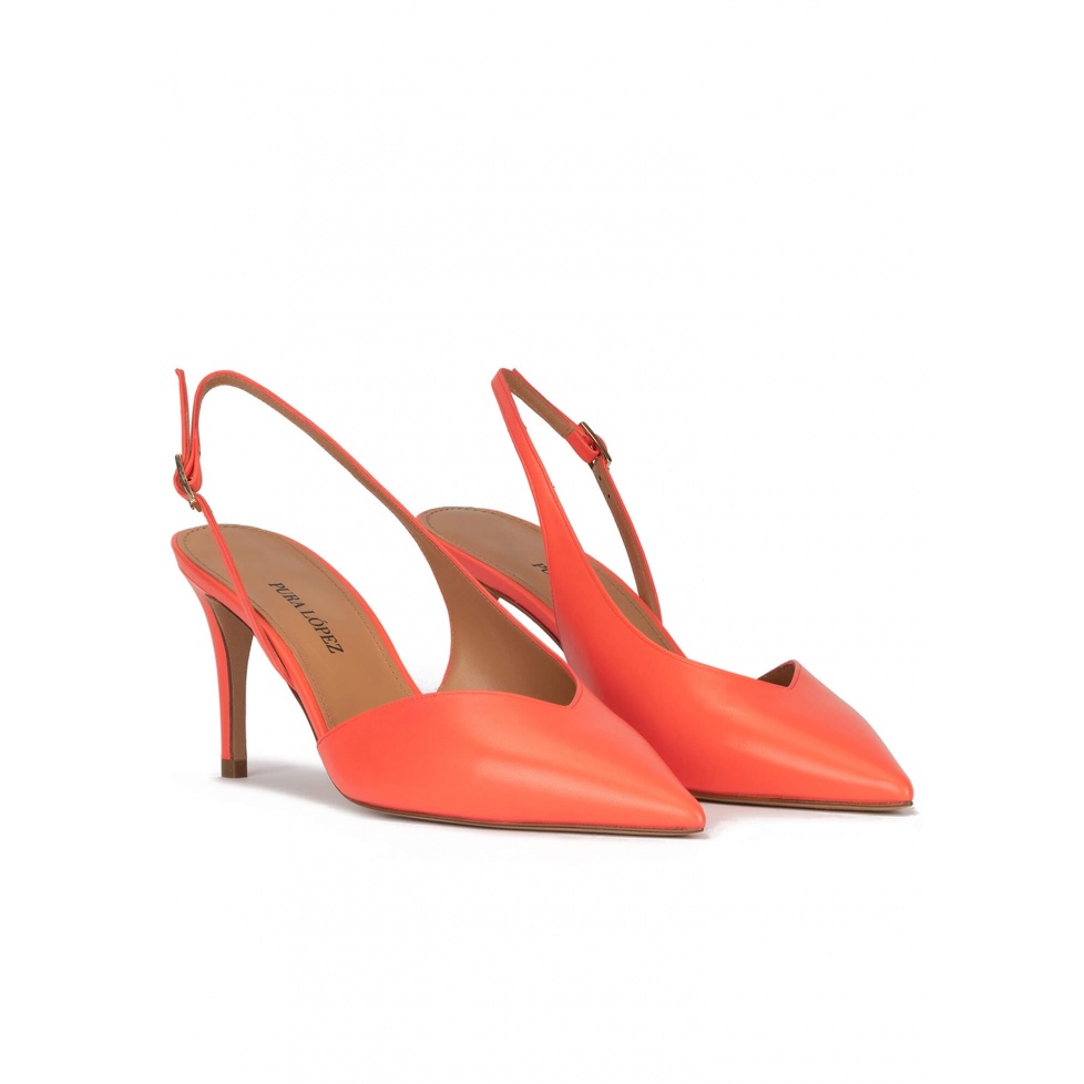 Asymmetric slingback pumps in coral leather