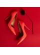 Heeled point-toe pumps in coral leather